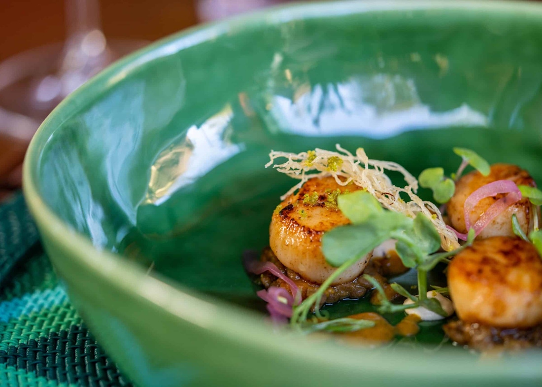 Gourmet food in a green ceramic bowl