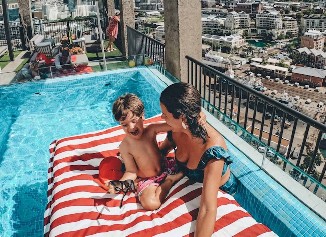 Mom and daughter playing in the pool